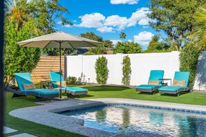 A swimming pool with lounge chairs and an umbrella. - The Brexton Luxe Scottsdale Resort-style Oasis (Scottsdale)