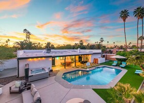 A modern house with a swimming pool, outdoor seating, and a patio area. - The Brexton Luxe Scottsdale Resort-style Oasis (Scottsdale)