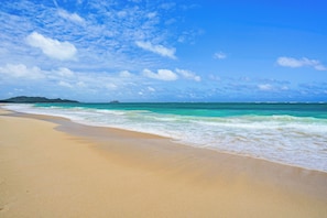 A beach with clear turquoise water and a sandy shore. - Ocean View! Waimanalo Beach Cottages, Unit 1 (Waimanalo)