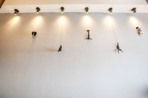 A ceiling with multiple light fixtures and hanging sculptures. - Romantic Zone Penthouse with Partial Ocean Views (Puerto Vallarta)