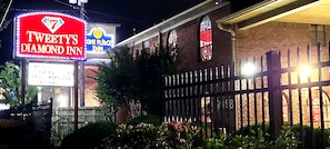 A building with a prominent sign for 'Tweety's Diamond Inn' and a smaller sign for 'One Place to Play.' - TWEETYS DIAMOND INN-NRG (Houston)