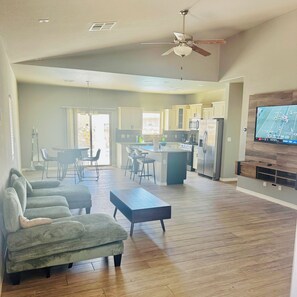 A spacious living area with a sofa set, a coffee table, and a ceiling fan. - Enjoyable 3-bedroom Pool house in vibrant El Paso steps away from sports complex (El Paso)