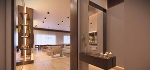 A modern living room with a sofa, coffee table, and decorative items. - The Epic 5602 Paradiso Grande Resort Orlando Florida (Orlando)