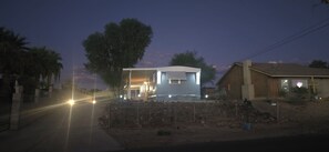 A two-story building with a flat roof and a visible garage door. - The Colorado Cowboy Hideaway - a 3 bed, 2 bath gem located in Bullhead City! (Bullhead City)