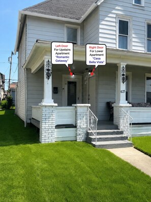 A two-story house with a front porch, a mailbox, and a number '621' on the right side. - Casa Bellavista | Walk to Falls | Skyline Views (Niagara Falls)