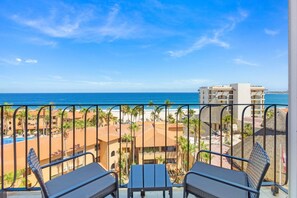 Private balcony with seating and sweeping views of the Sea of Cortez. - Vista La Jolla 406 | 2BR Suite Ocean View (San José del Cabo)