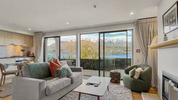 Bright open-plan living with lake and mountain views