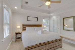 A bedroom with a bed, nightstands, a ceiling fan, and a window with blinds. - 3BR + Gated Parking | Sleeps 8 /Mins to Broadway (Nashville)