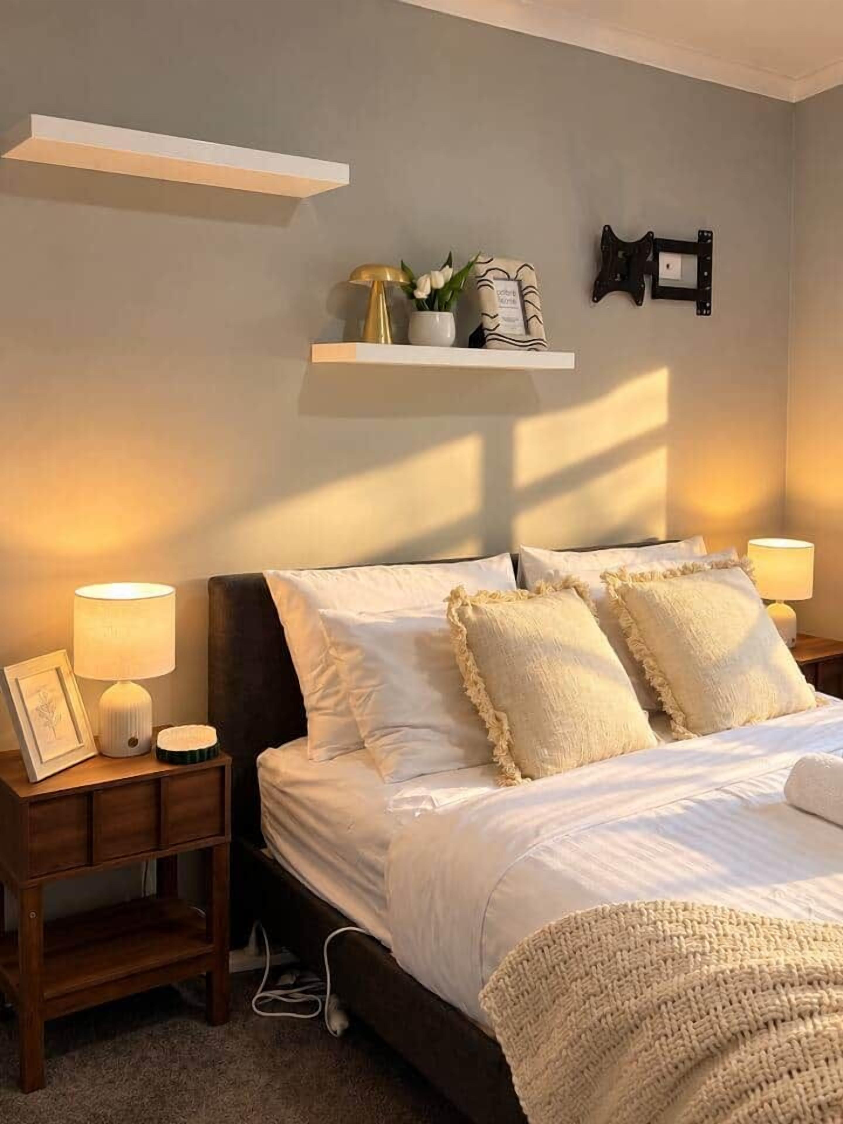 Peaceful Queen bedroom offering a relaxing space for couples or individual guests.