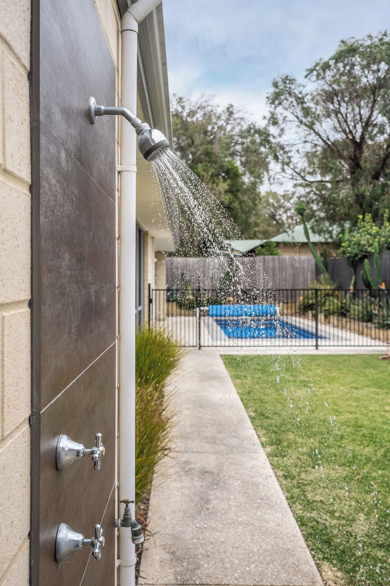 Rinse off beneath the outdoor shower after a swim.