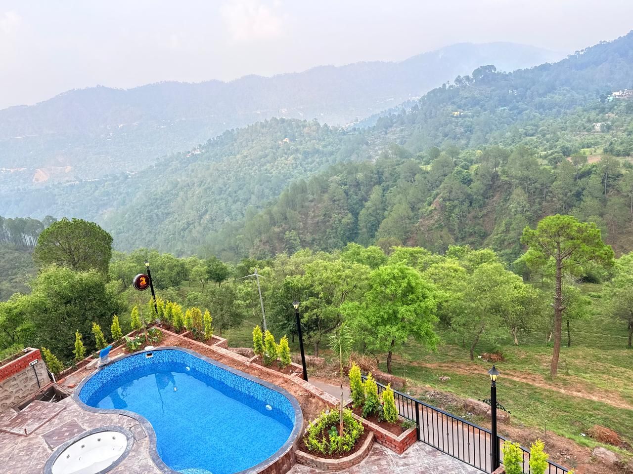 A swimming pool with a view of a mountainous landscape.