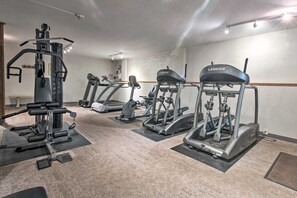 A gym with various exercise machines, including treadmills and weight training equipment. - Poconos Cabin w/ Sauna! Lakes ~ Skiing ~ Fire Pit (Big Bass Lake)