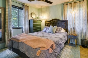 A bedroom with a bed, dresser, bedside table, and a window. - Poconos Cabin w/ Sauna! Lakes ~ Skiing ~ Fire Pit (Big Bass Lake)