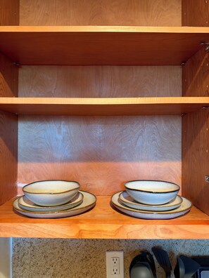 A kitchen with wooden cabinets and a countertop. - Superb 3-bedroom cabin with AC in delightful San Jose (San Jose)