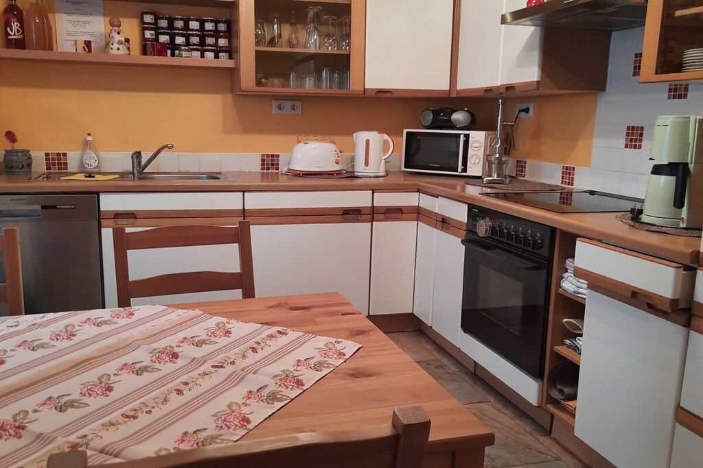 A compact kitchen with a microwave, toaster, and coffee maker.