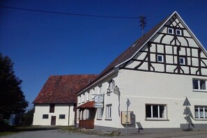 A traditional half-timbered building with a sign indicating a pub named 'Kreuz.' - Holiday apartment with 3 bedrooms (Mühlingen)