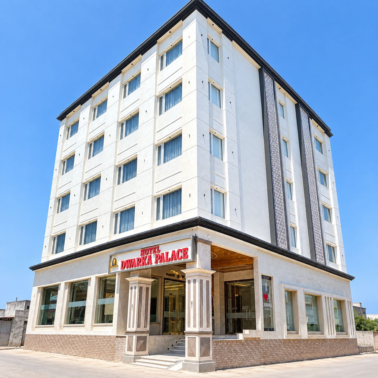 A multi-story hotel with a prominent entrance and a sign reading 'HOTEL D'WARKA PALACE'.
