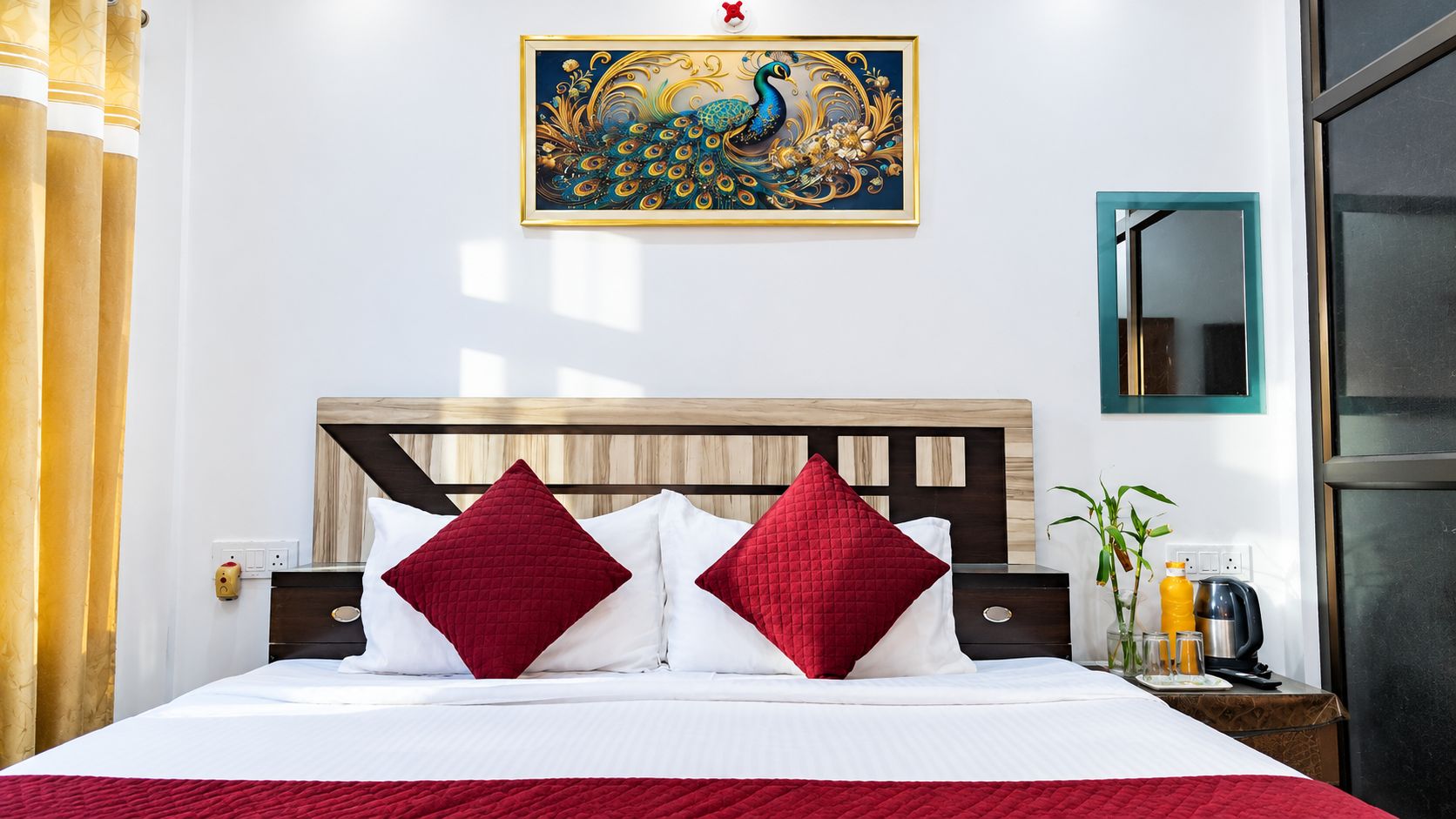 A hotel room with a bed, a nightstand, a wall-mounted painting, and a window.