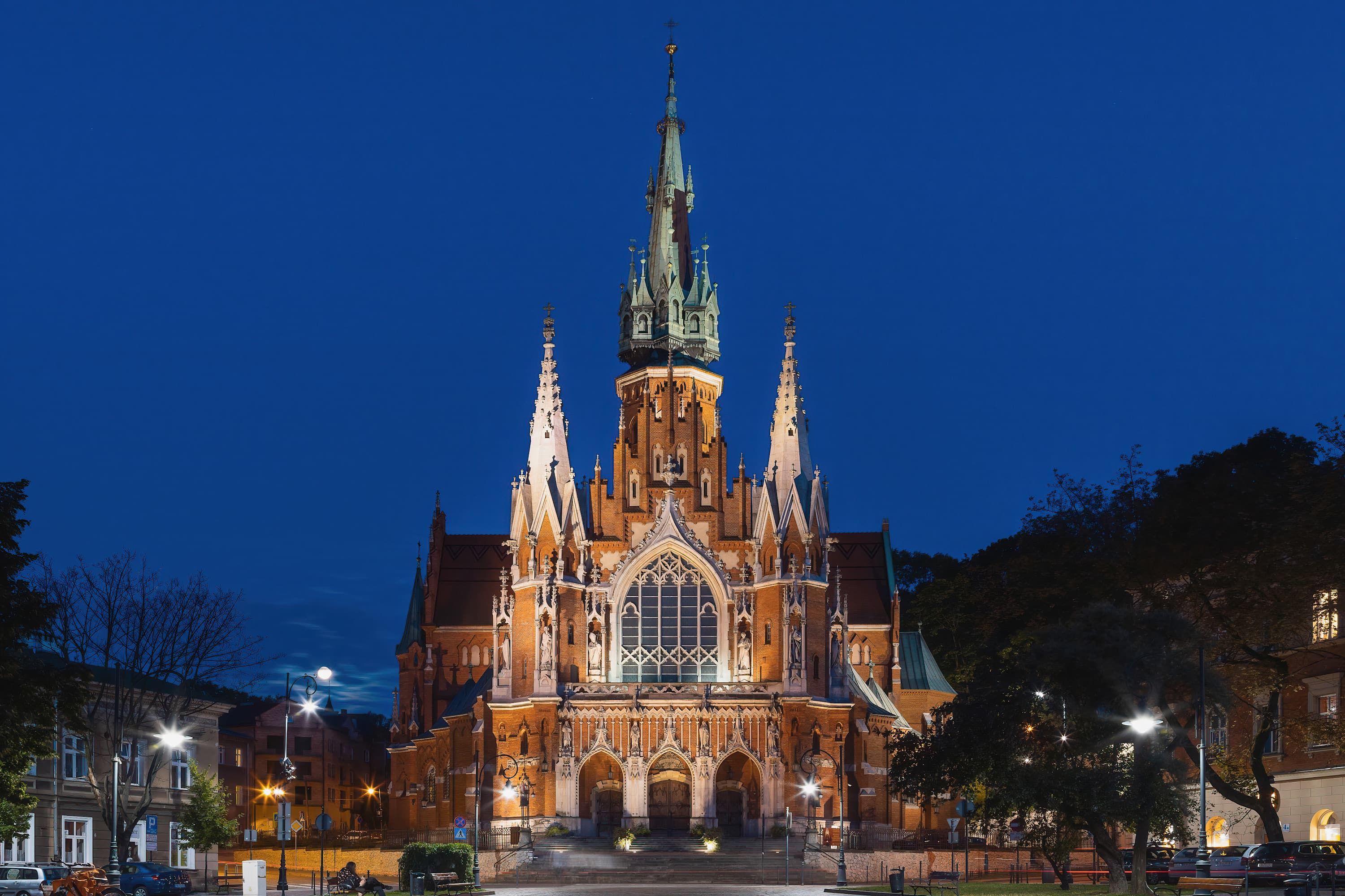 A Gothic-style church with a tall spire and intricate facade.