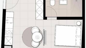 Plano de planta con cocina, comedor y baño.