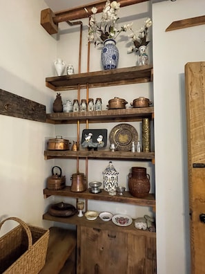 A wooden shelf with various kitchenware and decorative items. - Private Downtown Toronto Apartment in the Annex with Free Parking (Toronto)