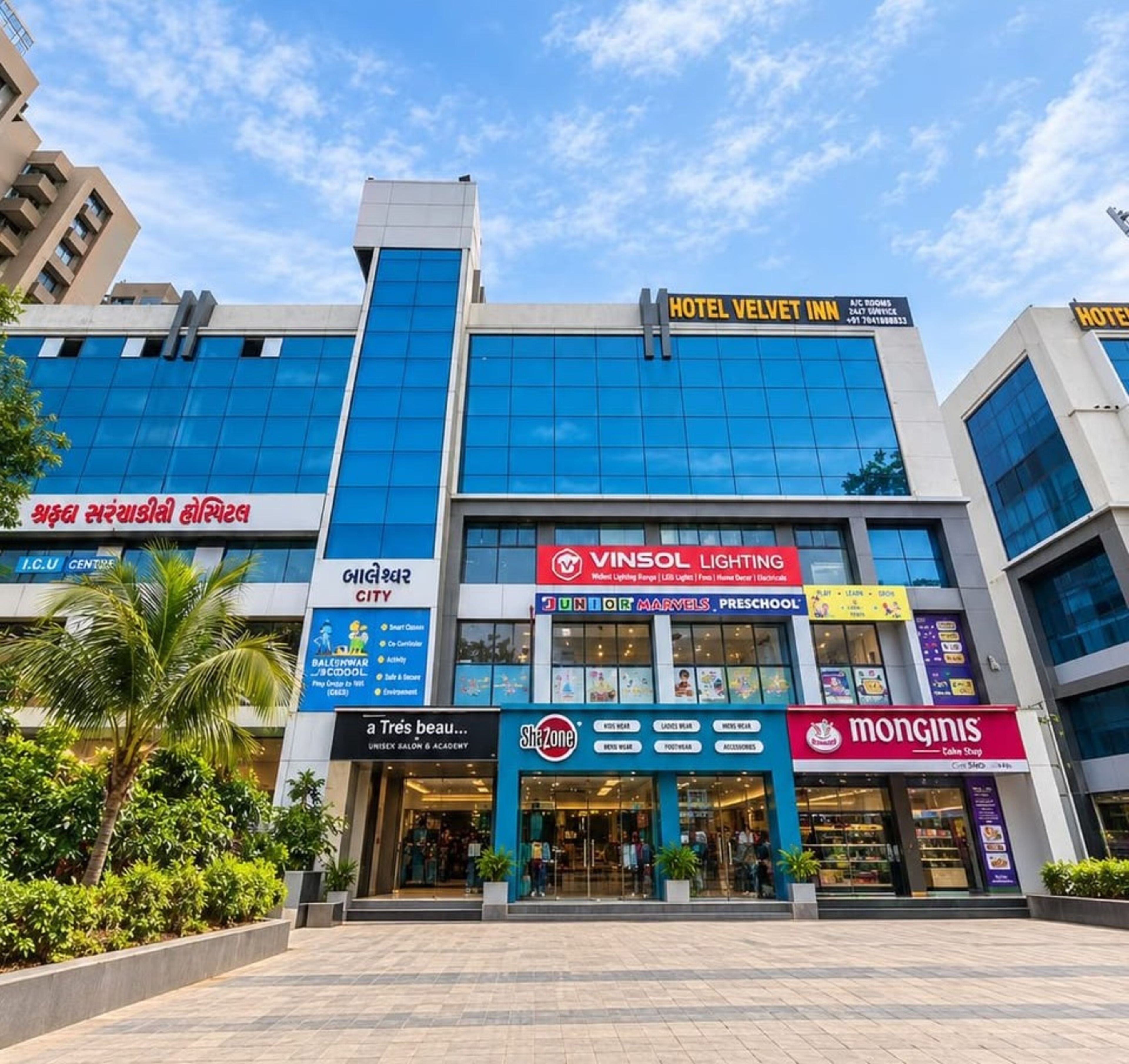 A hotel with a modern facade, a visible sign for 'Hotel Velvet Inn', and a storefront for 'Vinsol Lighting'.