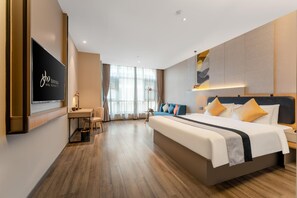 A hotel room with a large bed, a desk, a TV, and a view of the outdoors. - Homeinn Selected (Xi'an)