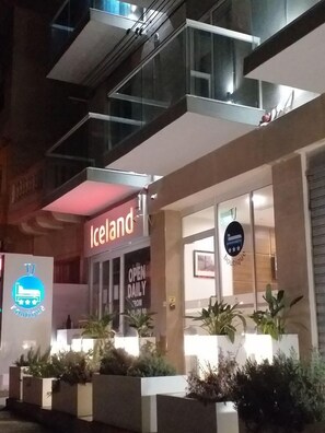 A modern building with a sign for 'Iceland Boutique' and a 'TV Boutique' sign. - TJ Boutique (Marsaskala)