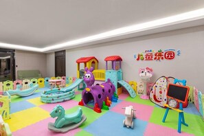 A children's play area with colorful play structures, including slides and a climbing frame. - Wyndham Garden Urumchi Tianshan International Airport (Ürümqi)