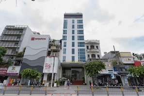 A hotel with a modern facade, a visible entrance, and a sign indicating it is a hotel. - A25 Hotel 55 Cach Mang Thang 8 (Ho Chi Minh Municipality)
