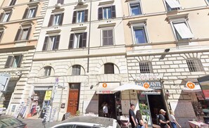 A multi-story building with a ground-floor restaurant and ATM. - Bernini in Cavour - Monti District (Rome)