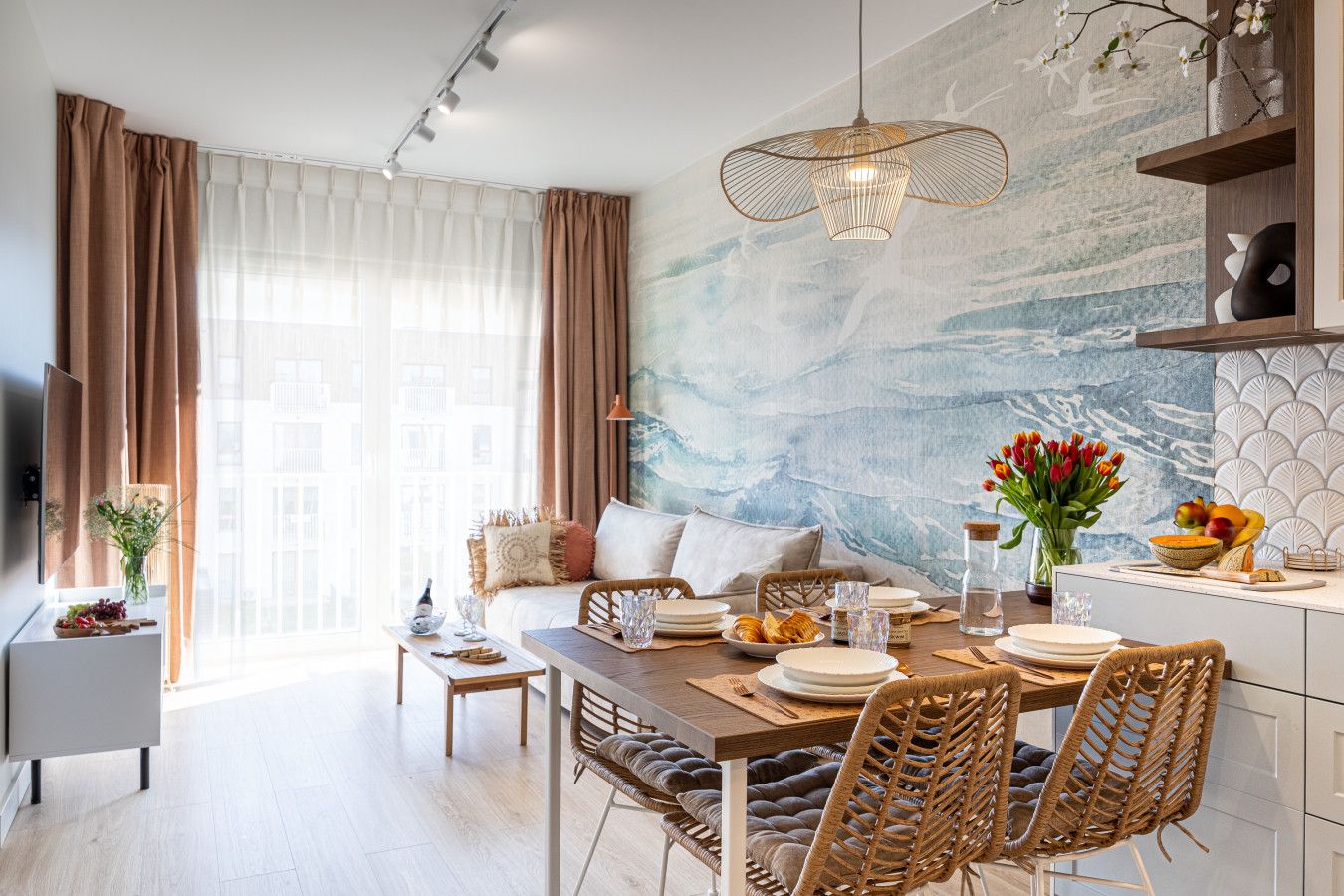 A modern living room with a dining area, a sofa set, a coffee table, and a dining table with chairs.