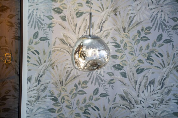 A spherical pendant light hanging from the ceiling.