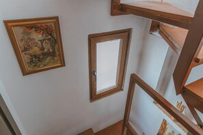 A staircase with wooden railings and a framed picture on the wall. - Gorgeous 2-bedroom building with AC in charming Antalya (Antalya)