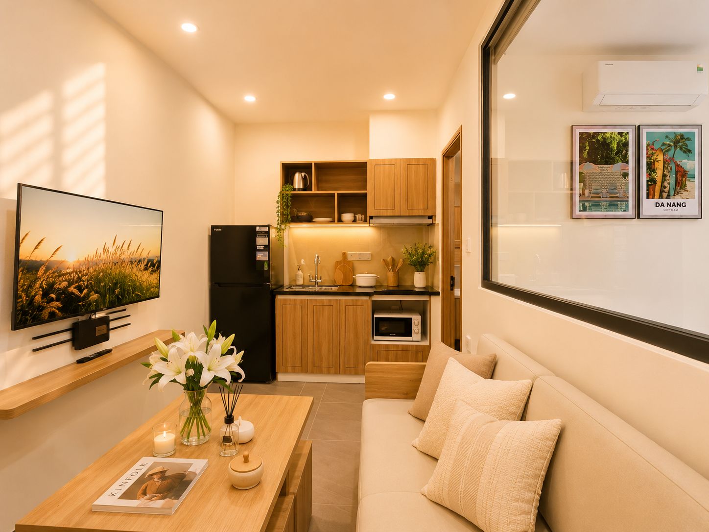 A compact kitchen with wooden cabinets, a black refrigerator, and a microwave.