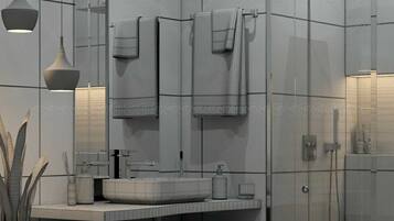 A modern bathroom with a large mirror, a sink, and a shower area.