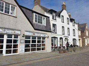 A traditional building with multiple windows and a sign for 'The Ship Inn' restaurant. - The Harbour Hoose Stonehaven (Stonehaven)