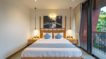 A modern bedroom with a large bed, wooden headboard, two bedside tables, and a large window with a view of greenery.