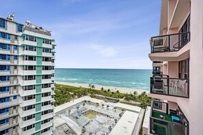 A high-rise building with a view of the beach and ocean. - Spacious 3BR Retreat Steps from the Beach with Resort Amenities 1508 (Miami Beach)