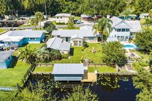 A residential area with houses, a swimming pool, and a dock. - Fisherman's Studio: Unit 1 (studio only) (Satsuma)
