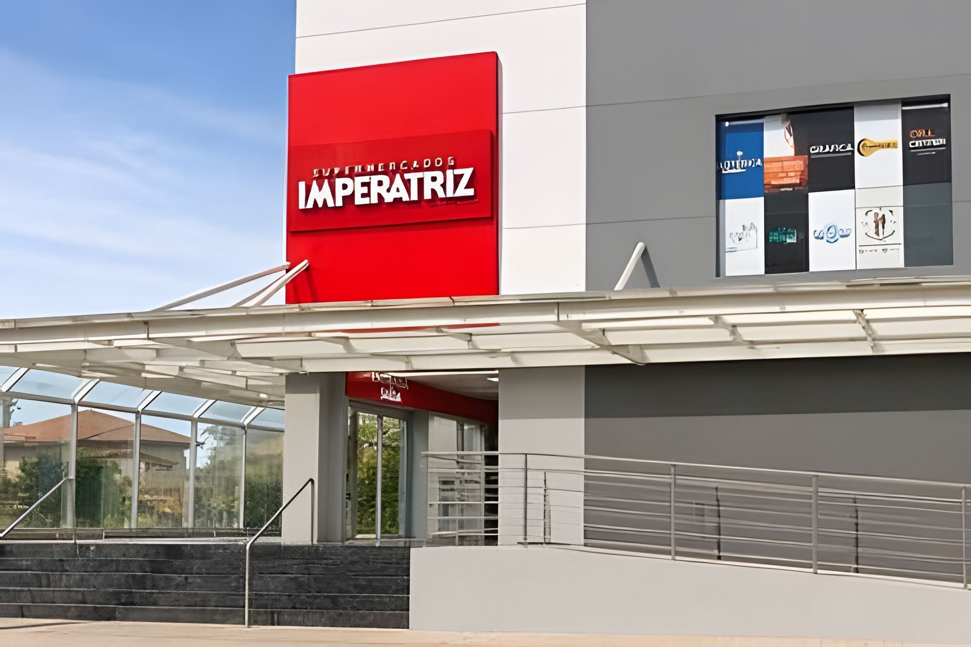 A modern building with a prominent red sign reading 'IMPERATRIZ'.