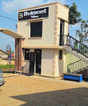 A building with a sign reading 'Belmont Villas.' - Belmont Hotel Mbale (Mbale)