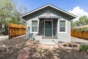 A single-story house with a front porch, a mailbox, and a number '731' on the door. - The Nook on 4th Street (Prescott)