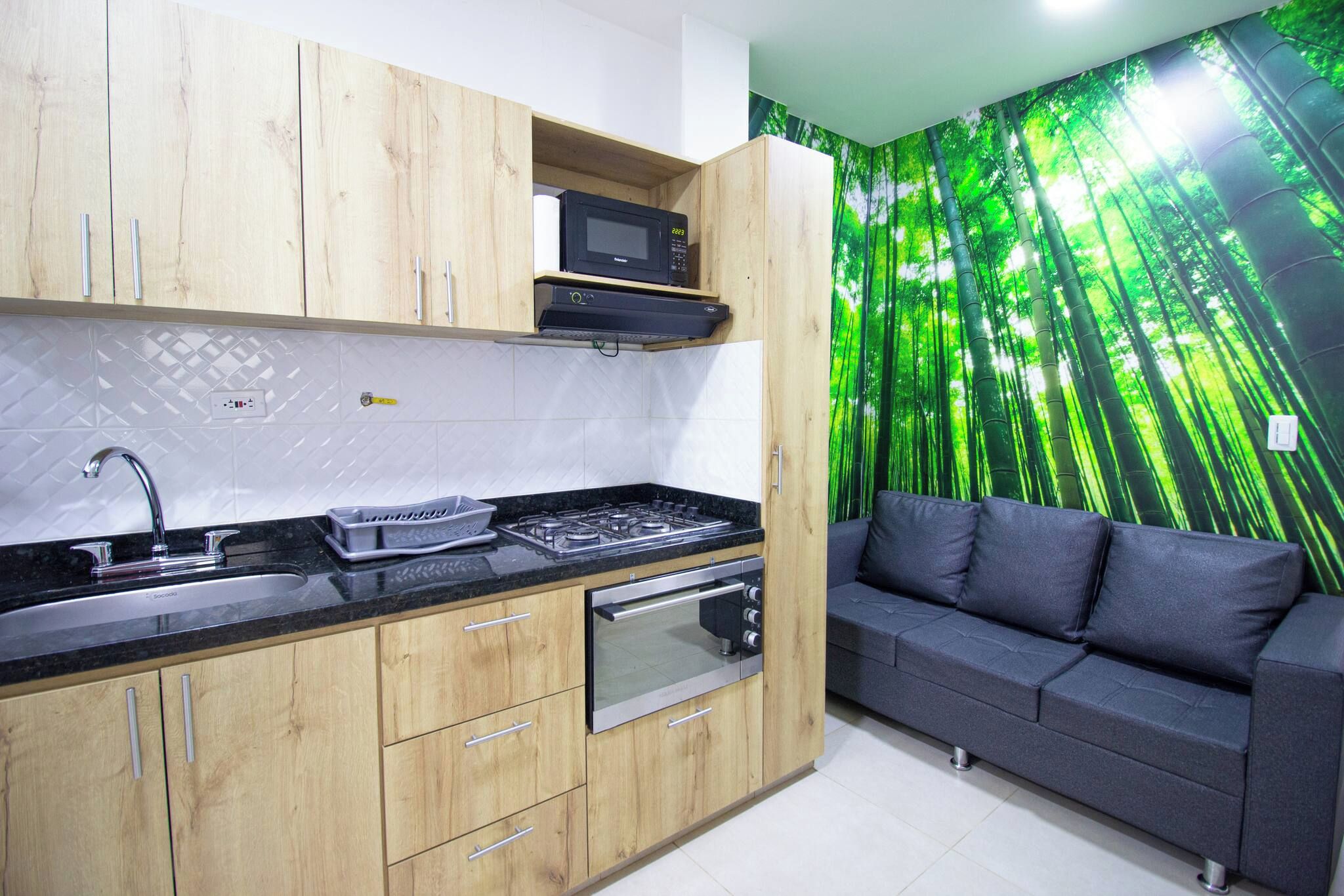 A modern kitchen with wooden cabinets, a built-in microwave, a gas stove, and a built-in oven.