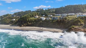 A coastal residential area with houses on a hillside overlooking the beach. - Sundown Cliffs- Premium Coastal Getaway with Breathtaking Ocean Views & Sunsets (Cloverdale)