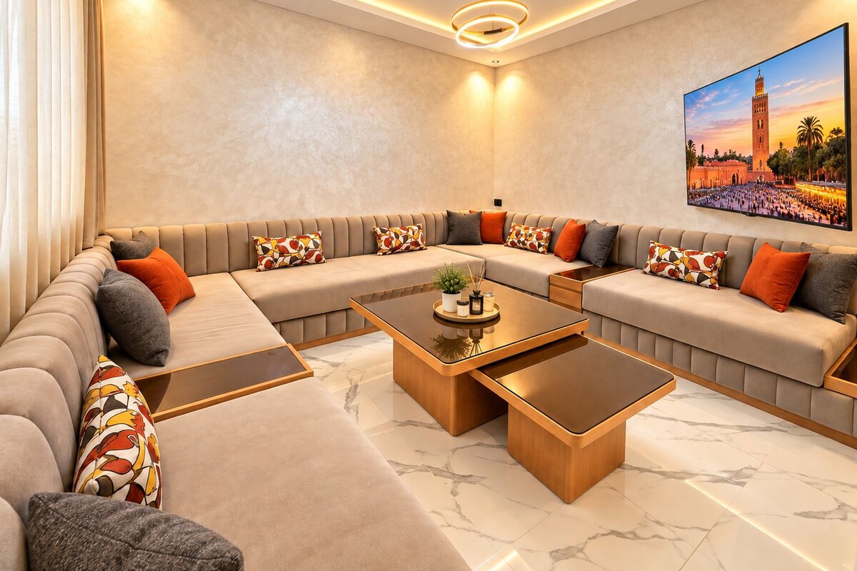 A modern living room with a sectional sofa, two coffee tables, and a large painting of a historic building.