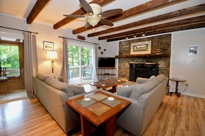 A living room with a sofa set, a coffee table, a fireplace, and a ceiling fan. - Pet-Friendly Mountain Retreat, Fire Pit + 2 Decks (Banner Elk)