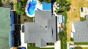A residential area with multiple houses, a swimming pool, and a garden. - Backyard OASIS w/ Putting Green, Patio & Pool! (Hilton Head Island)