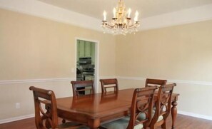 Elegant formal dining room with chandelier and seating for six