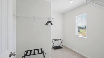 Closet space with a luggage rack so you can settle in for the stay